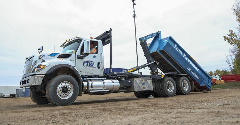 Truck with rolloff dumpster