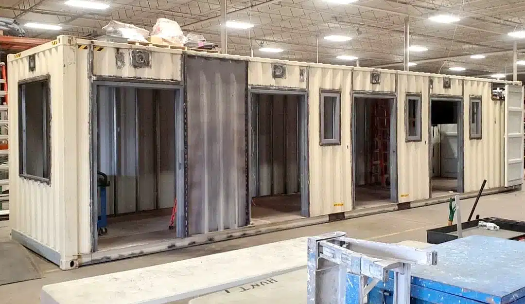 Tan shipping container being modified