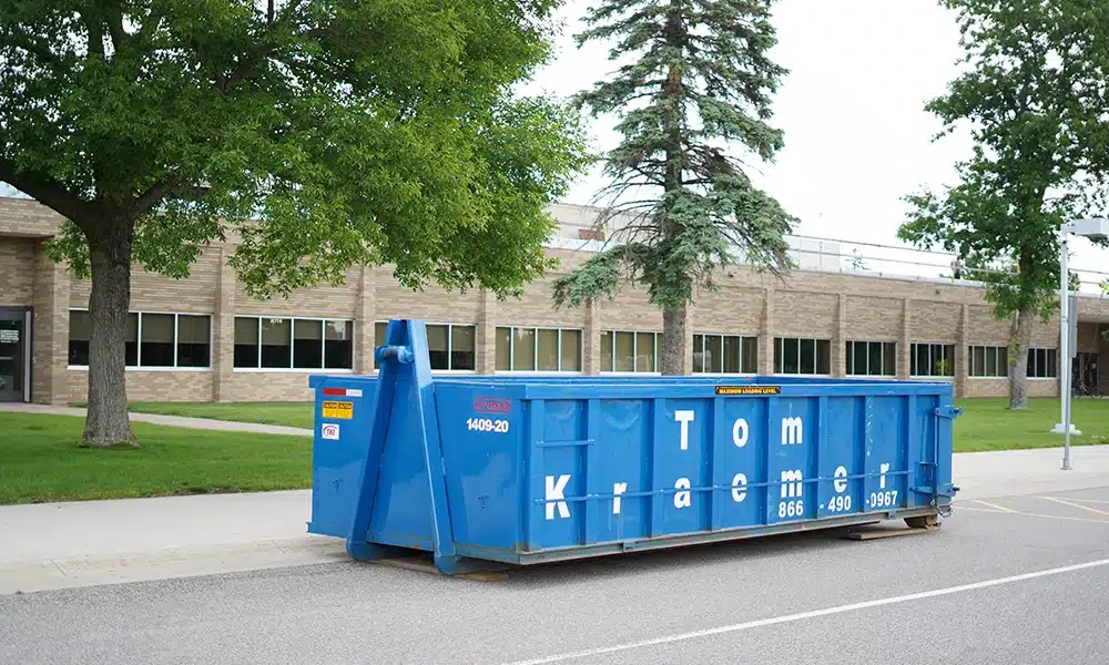 TKI Dumpster sitting near commercial building
